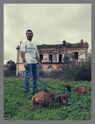 Alejandro Gonzalez with his family of dachshund dogs in the park in Toulouse, France.